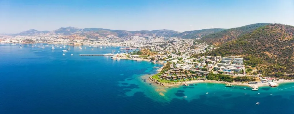 Panoramic aerial view of sunny Bodrum with resorts and beachfront villas