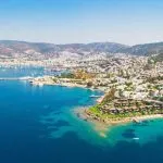 Panoramic aerial view of sunny Bodrum with resorts and beachfront villas
