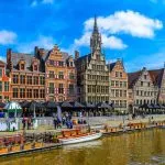 View of Graslei quay and Leie river in the historic city center in Ghent (Gent), Belgium. Architecture and landmark of Ghent. Cityscape of Ghent.
