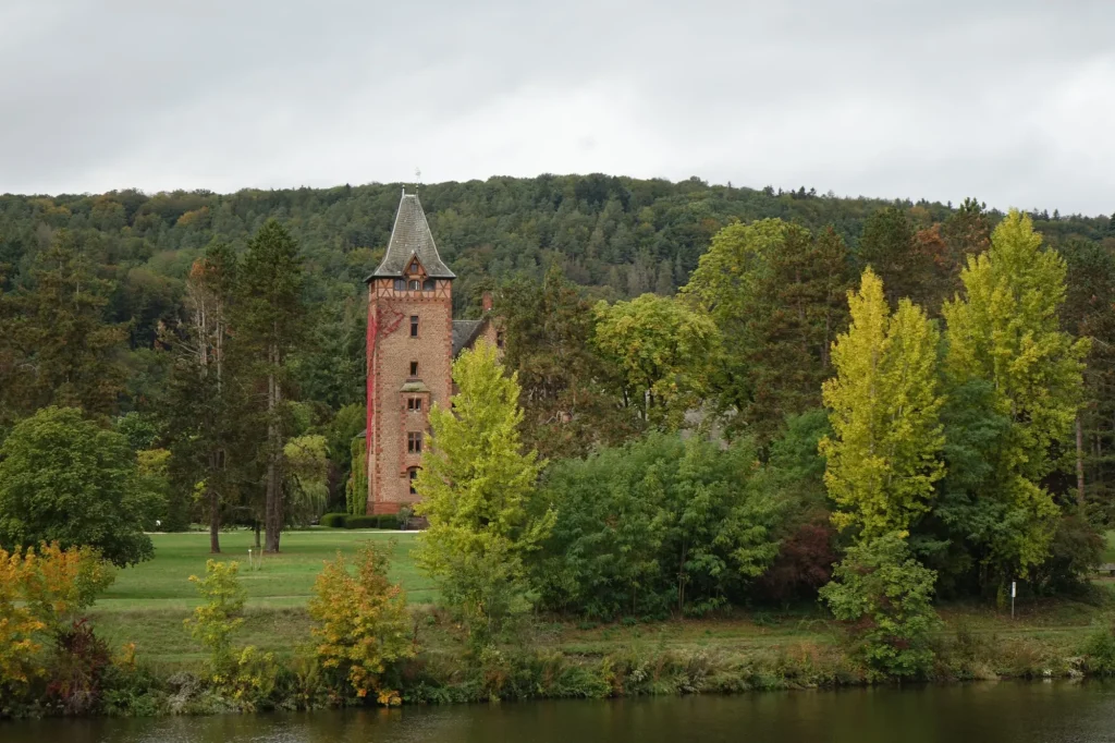Old castle in a park at a river, Mettlach, Saarland, Germany