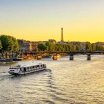 Sunset view of Eiffel tower, Pont des Arts and Seine river in Paris, France
